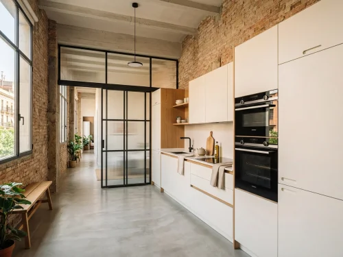 Aseo contemporáneo con microcemento continuo y hornacina en Les Corts