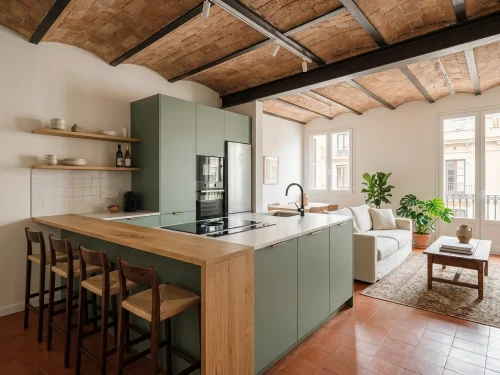 Cocina abierta al salón con isla central en Gràcia