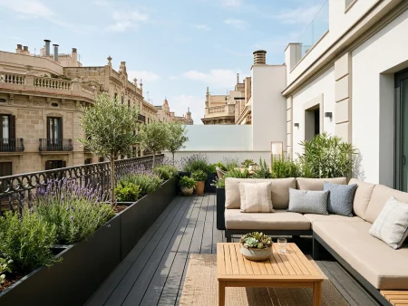 Reforma de terraza en Eixample con tarima exterior de composite y jardineras perimetrales